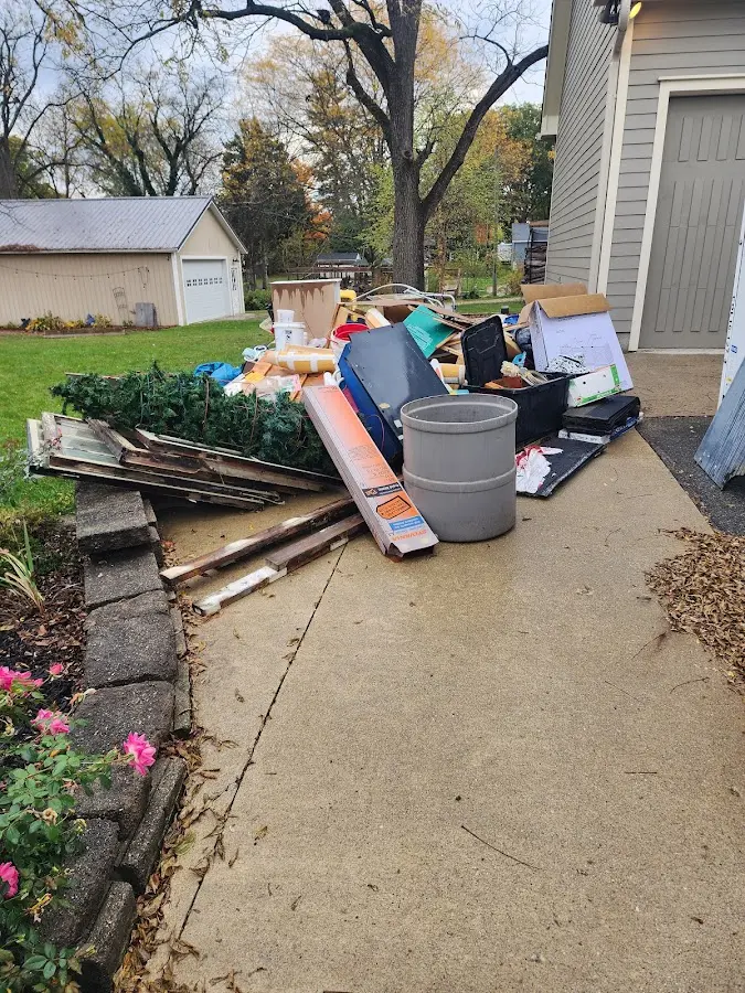 Dumpster being loaded with debris for Roofing Dumpster Rental in Chambersburg